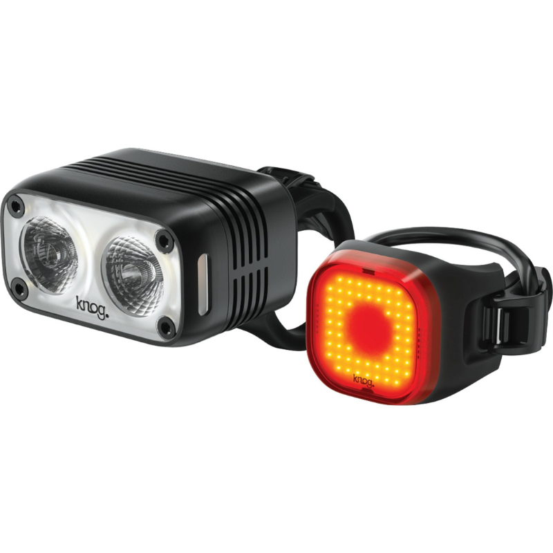 Knog Blinder Front double beam and Square LED  Rear Light Set, both lights next to each other with white back ground, both with rubber strap mounts..