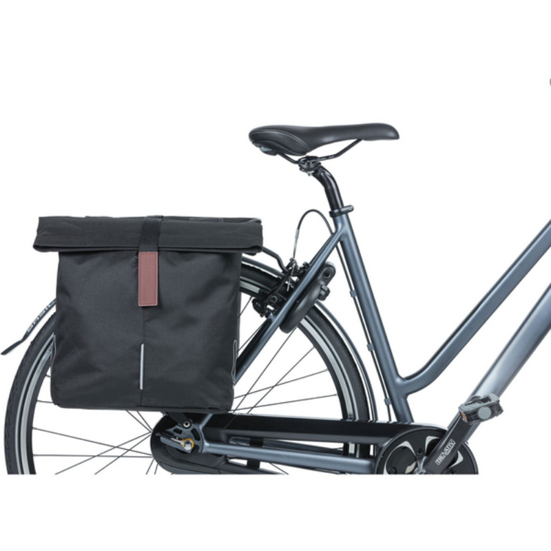 Bicycle with a black bag attached to the back on a white background