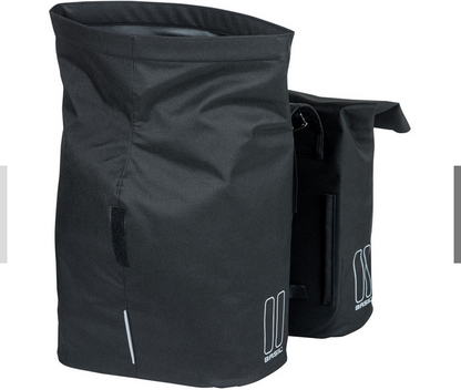 Black cycling panniers with a visible brand logo showing how bag opens on a white background