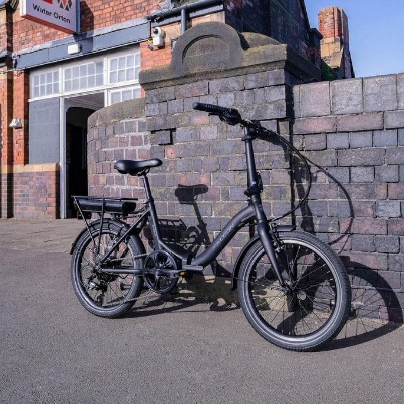 FALCON-BREEZE-E-Bike-leaning against train station wall
