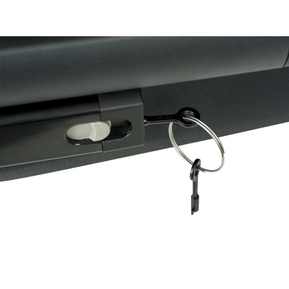 Close-up of a black metal lock or latch with a key inserted into a silver split ring keychain, shown against a white background.