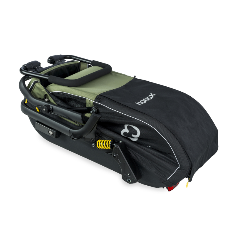 A black and olive green hamax stroller folded,  on a clean white background.