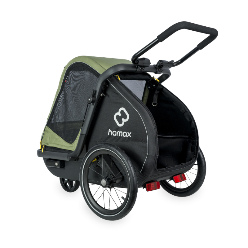 Black and green Hamax stroller on a white background with rear opening zipped open